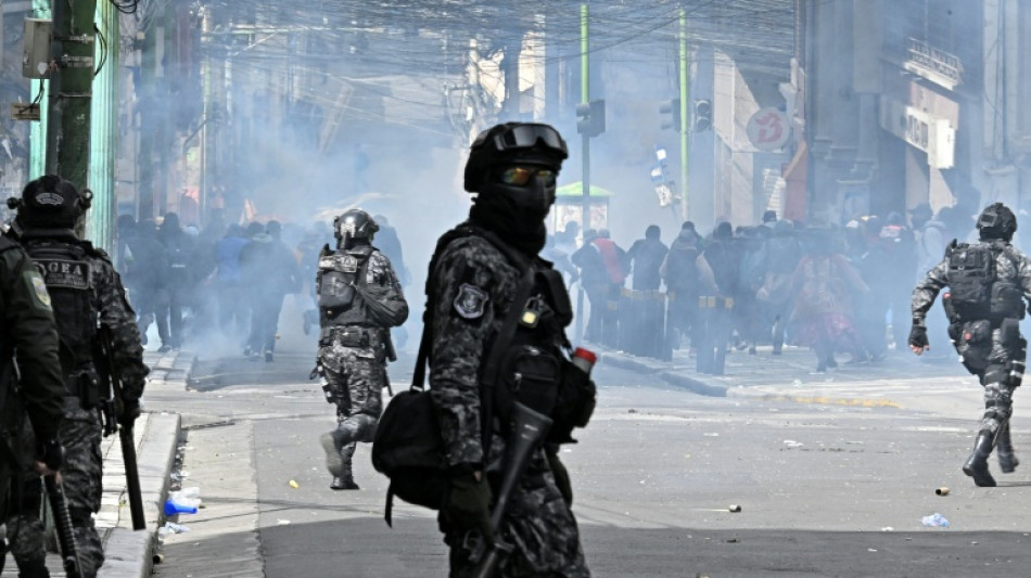 Police, protesters clash in new marches against Bolivian leader