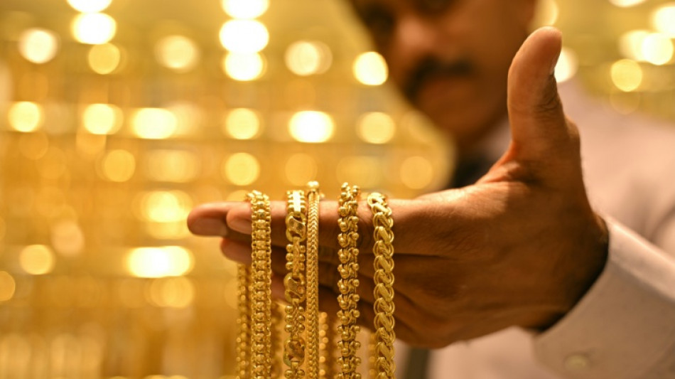 US stocks edge lower from records as precious metals surge