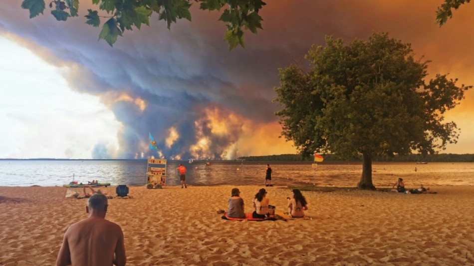 Over 100,000 flee or hole up indoors as wildfires rage in France and Spain