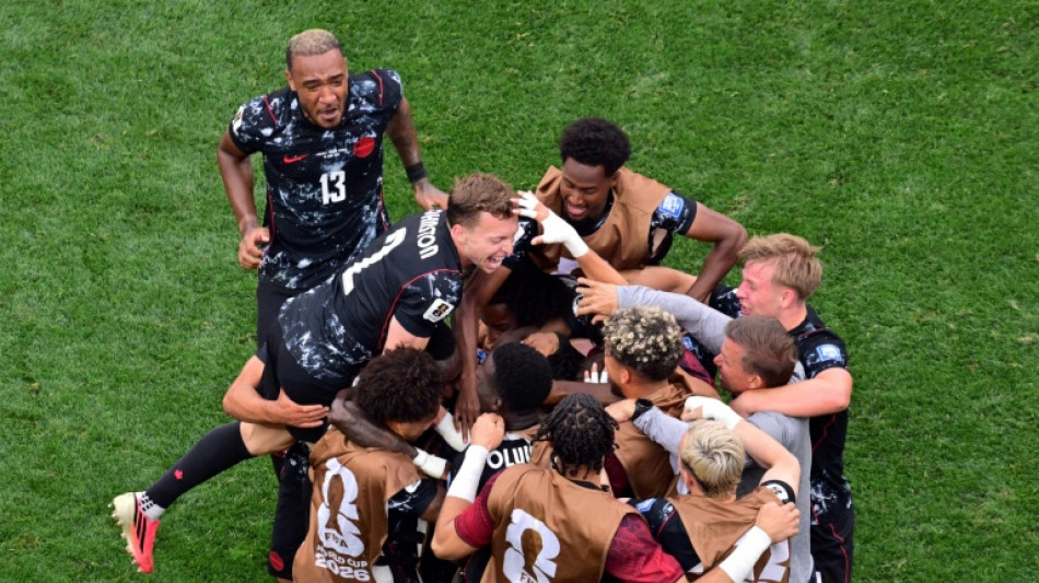 Canada reach World Cup last 16 as late strike sinks South Africa