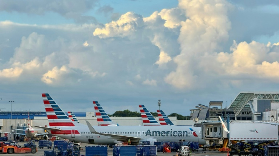 American Airlines reports smaller loss, sees travel demand improving