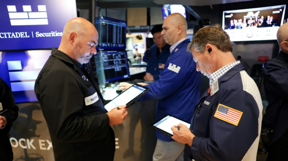 Triple record à Wall Street, poussée par les perspectives de baisses des taux