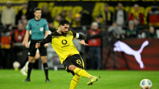 Last-gasp Can penalty gives Dortmund win against St Pauli