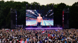 Parisienses voltam &agrave; cidade atra&iacute;dos pela festa ol&iacute;mpica, ap&oacute;s fugirem do 'caos'
