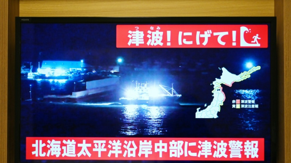 10 reported hurt after big Japan quake, warning of more tremors