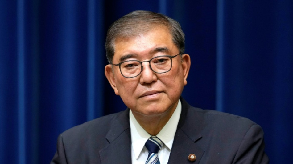 'Trump Whisperer' ex-minister joins Japan PM race
