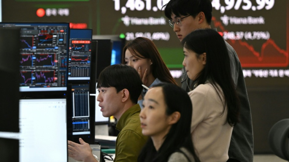 Stock markets drop amid tech concerns before rate calls